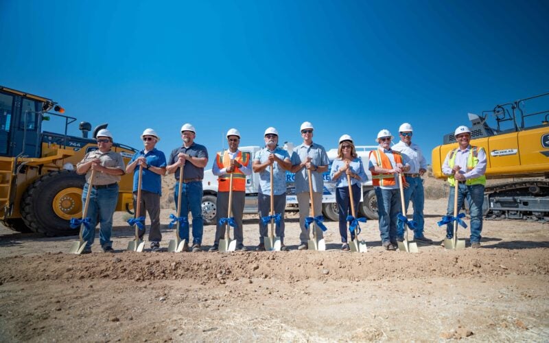 Officials with golden shovels at groundbreaking event.